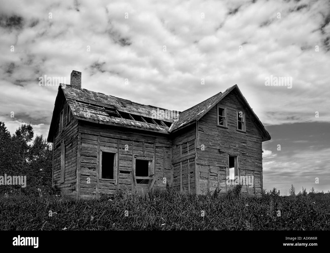 wooden house falling into ruin Stock Photo
