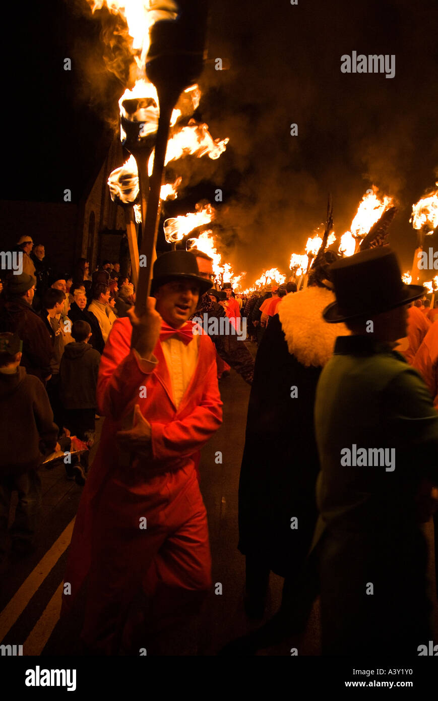 dh Up Helly Aa fire procession LERWICK SHETLAND Guizers with torches following Viking parade people festival Stock Photo