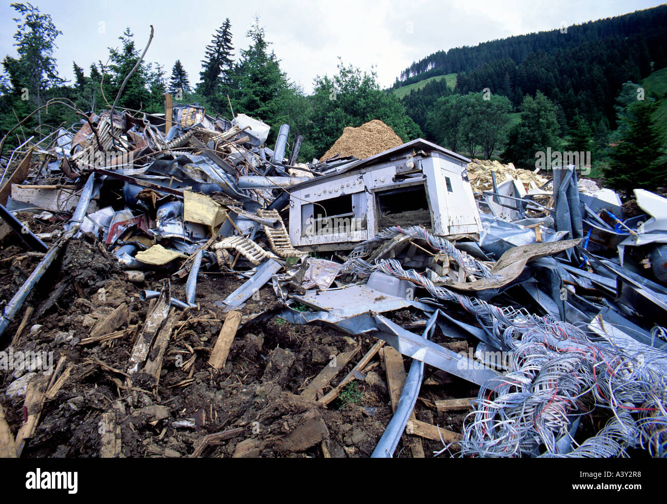 historic picture year of 1996 collected metalware for recycling cottages destroyed by mudslide switzerland Stock Photo