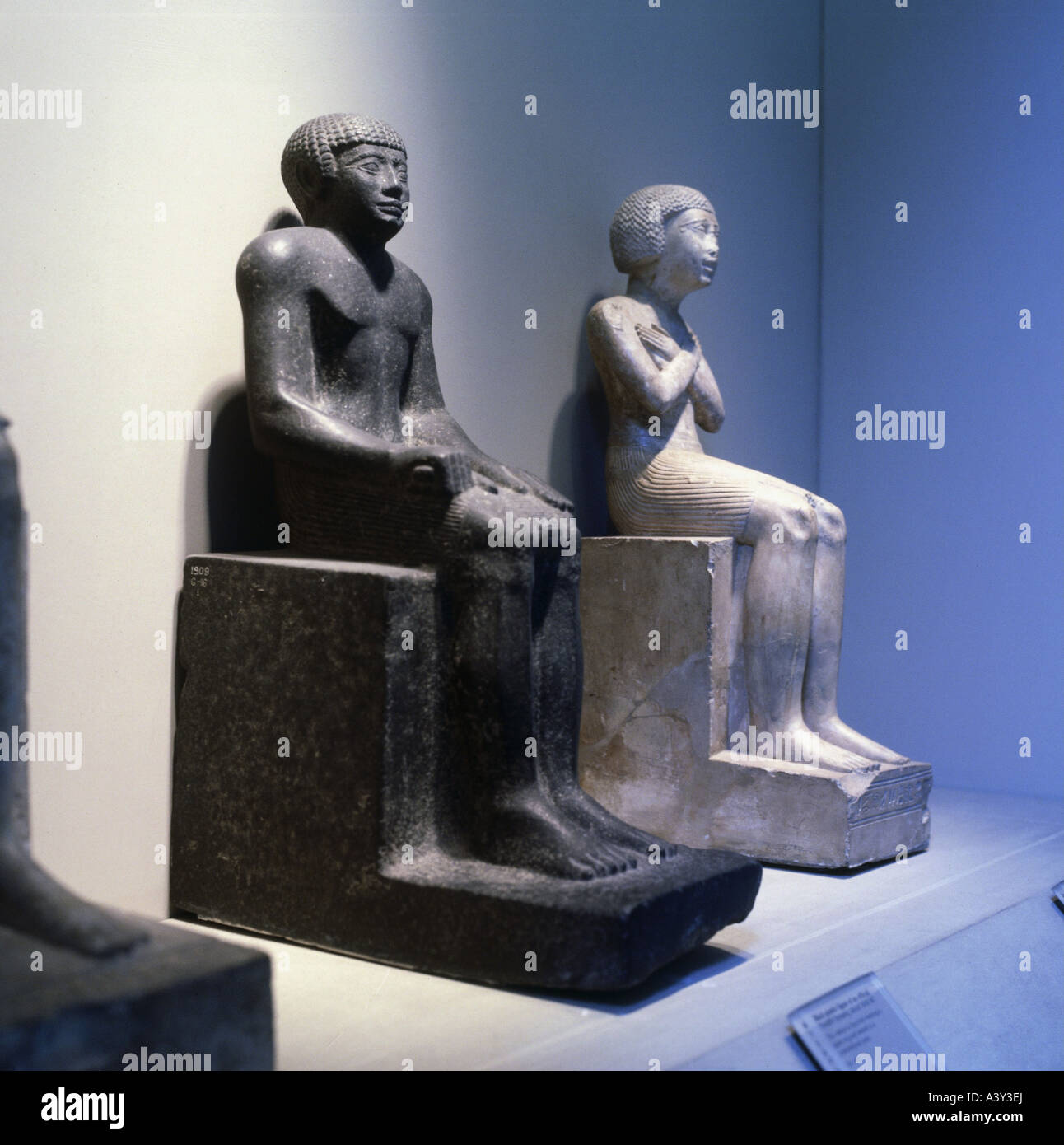 fine arts, ancient world, Egypt, Old Kingdom, sculpture, left: sitting figure of official, granite, circa 1850 BC, right: sittin Stock Photo