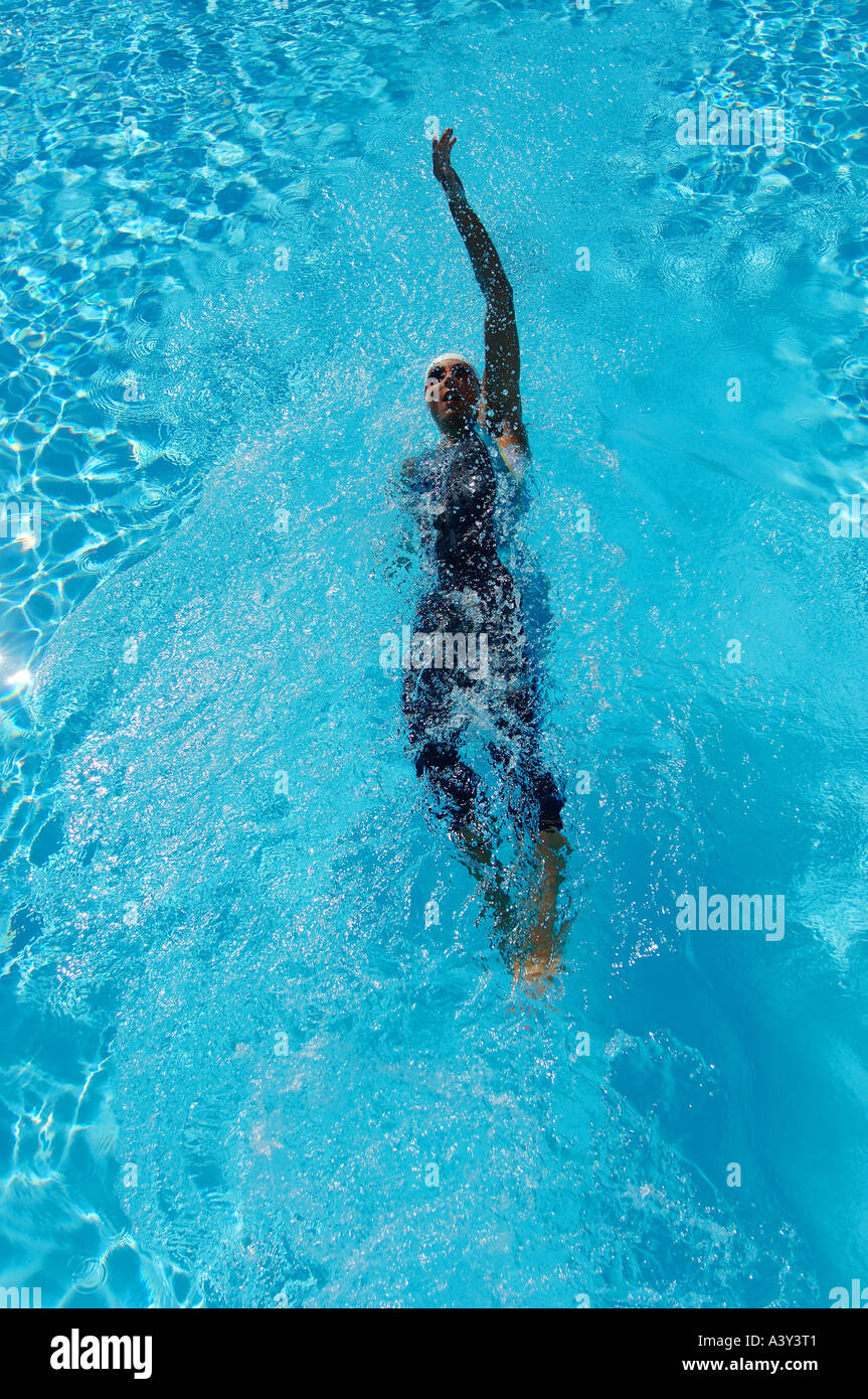 Bird s Eye View of Female Swimmer Swimming Backstroke Stock Photo