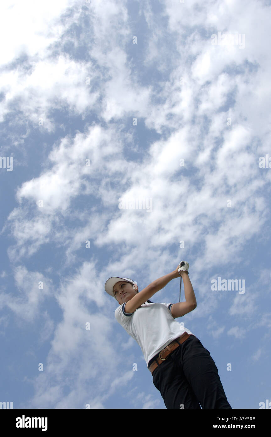 High angle view of a woman playing a golf stroke Stock Photo