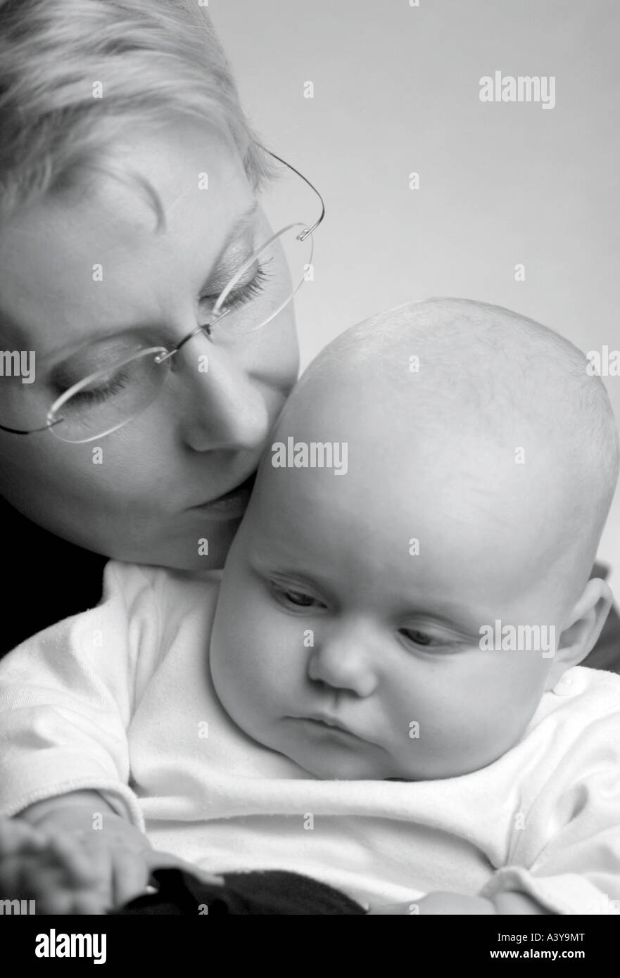 people, human beings, humans (Homo sapiens sapiens), mother kissing baby Stock Photo