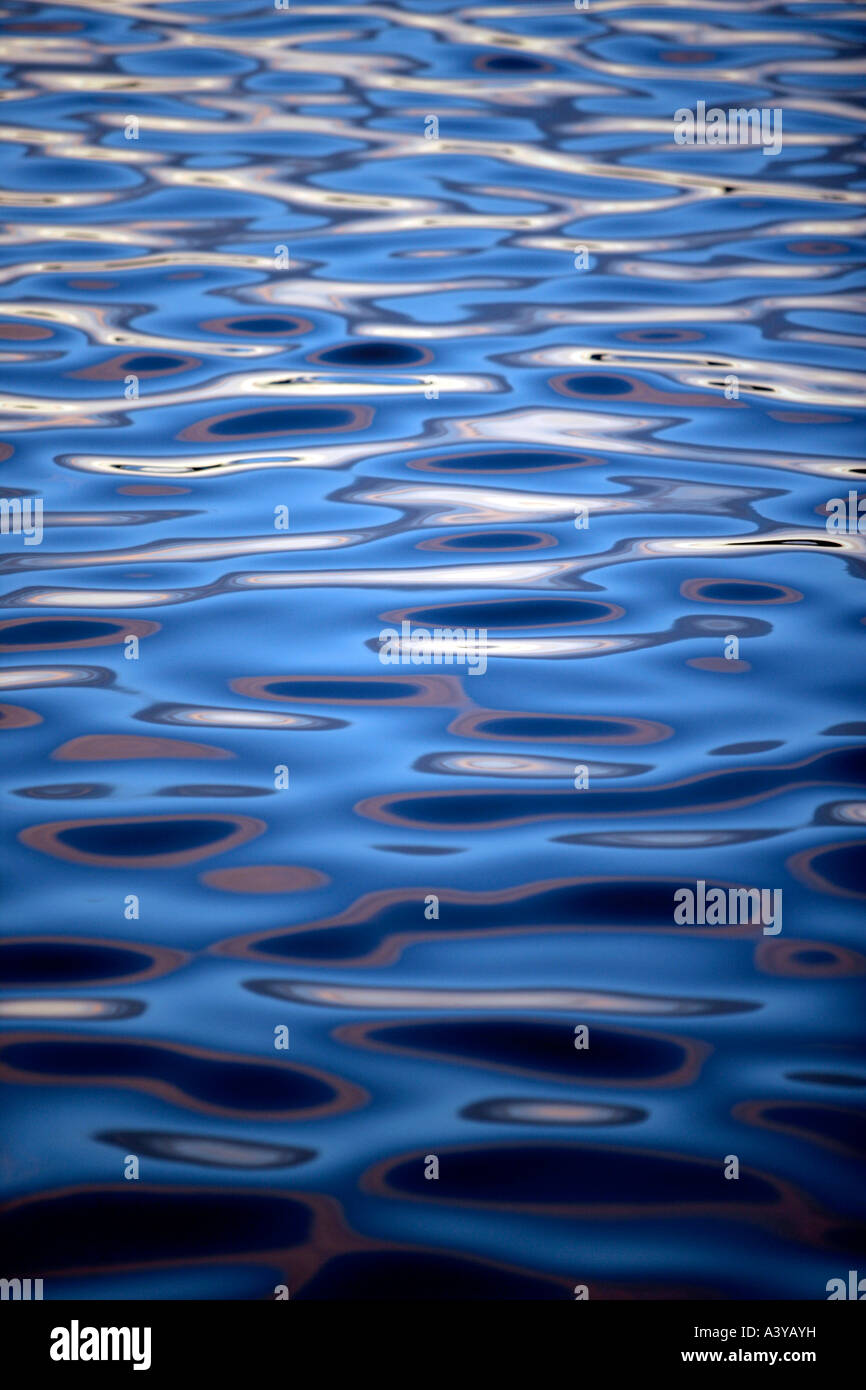 Ripples on calm blue water Stock Photo - Alamy