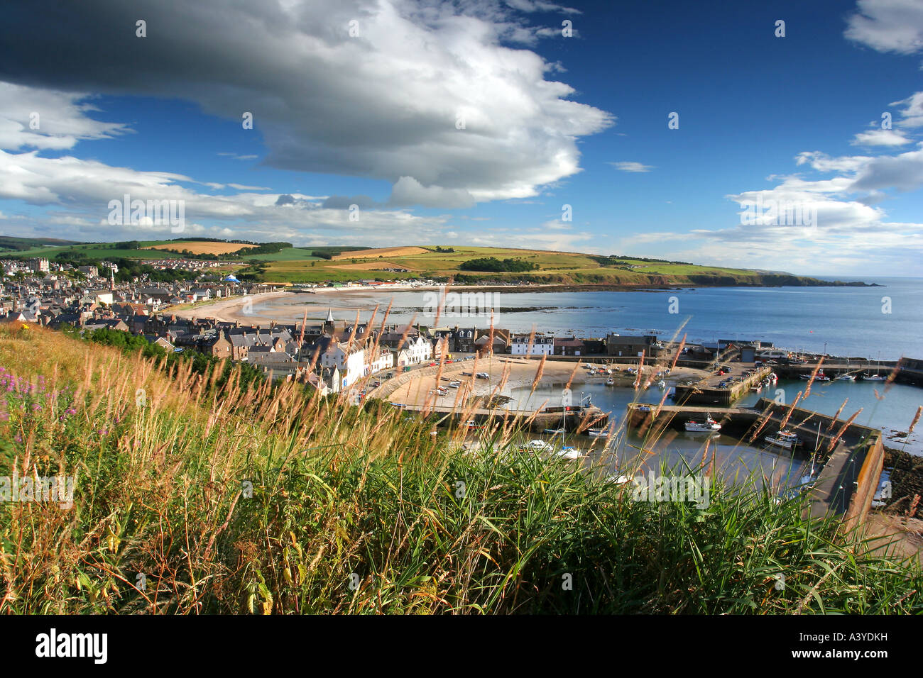Stonehaven Harbour and North East Scotland coastline with vibrant spring skies. Stock Photo