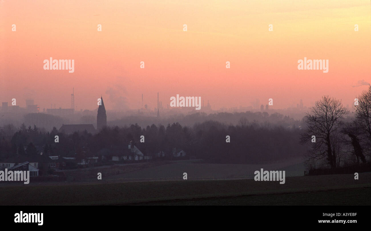 The towns of Geleen and Sittard in the Netherlands at sunset and with their associated haze Stock Photo