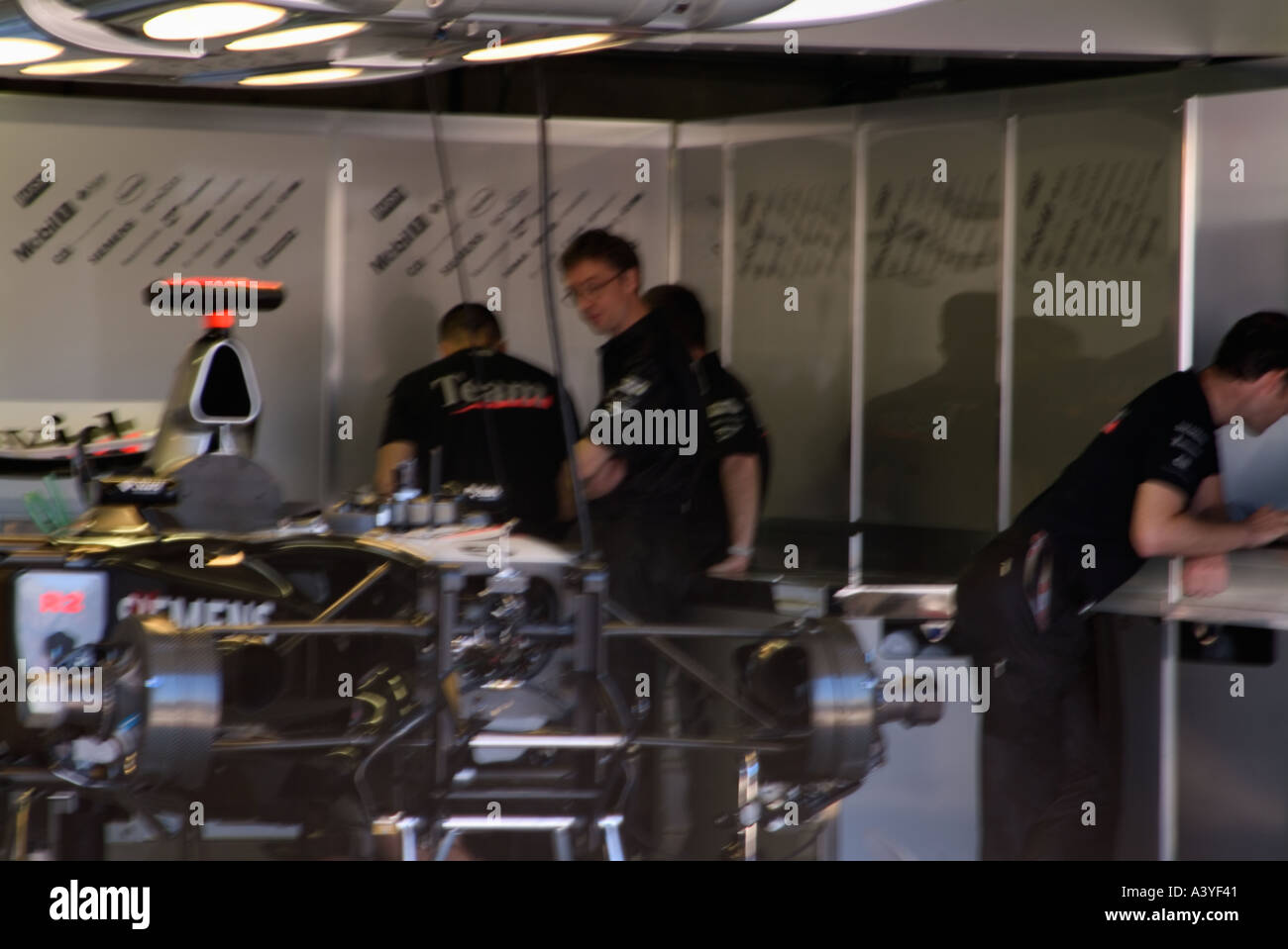 Formula 1 racing car pit lane front garages siemens mechanics Gilles