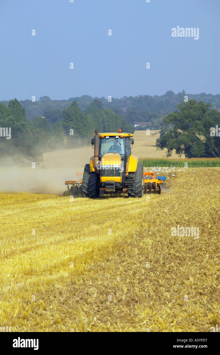Caterpillar tractor and disc harrow Stock Photo Alamy