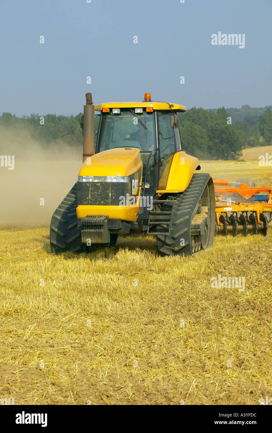 Caterpillar tractor and disc harrow Stock Photo Alamy