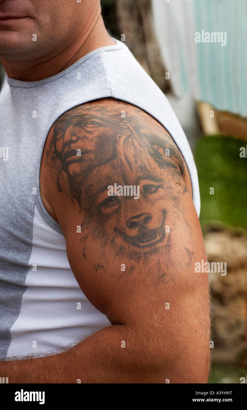 A Muscular Man With A Tattooed Arm Stock Photo Alamy