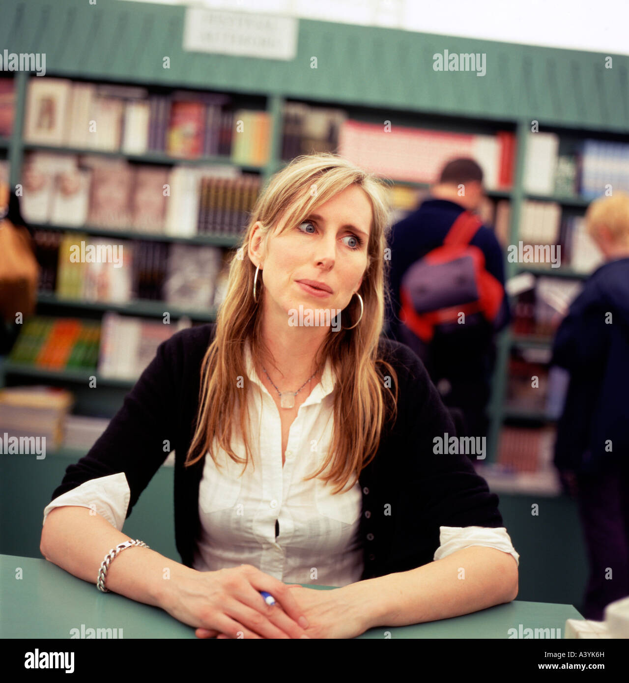 Female childrens author book signing hires stock photography and