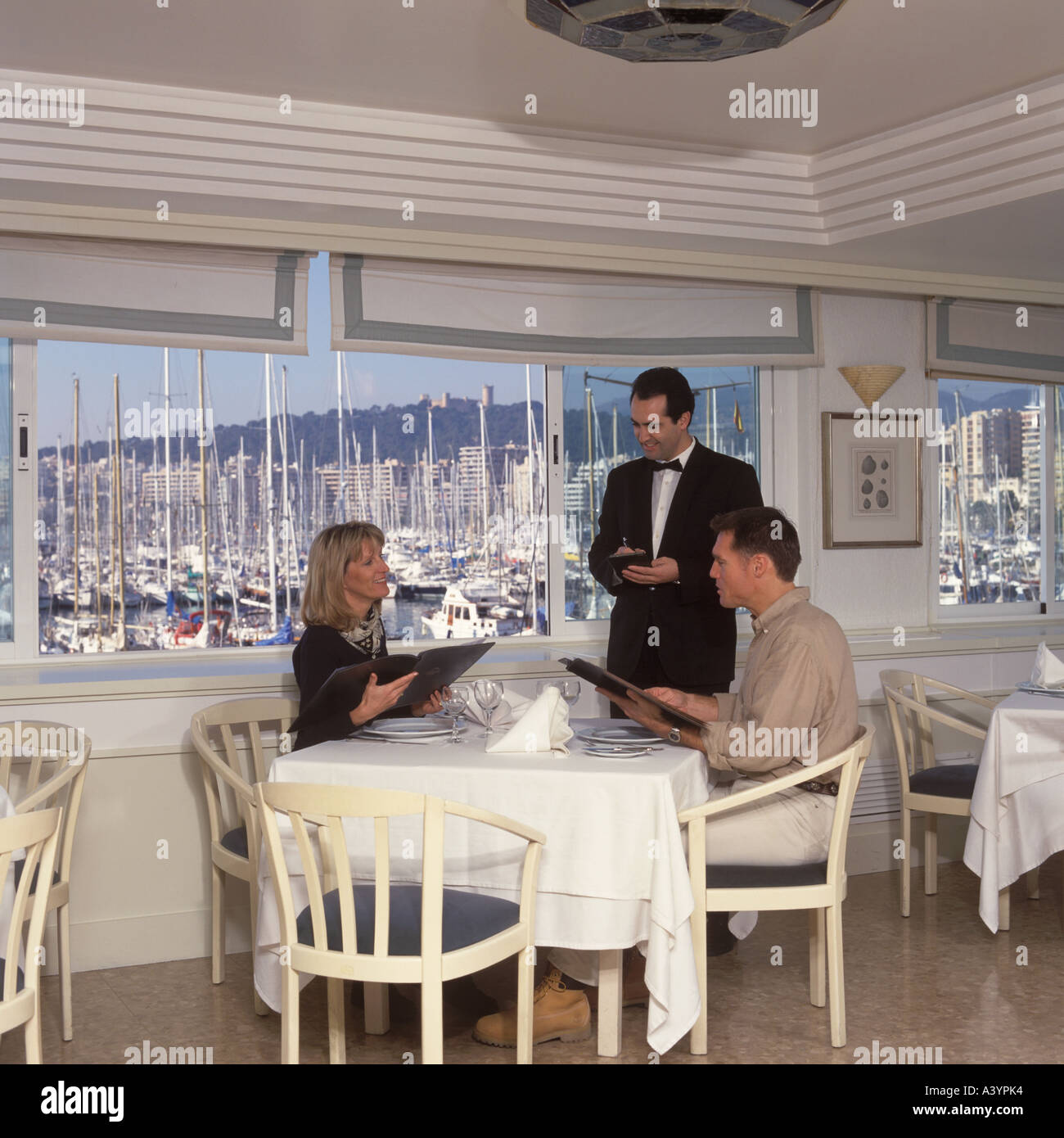 Lunchtime scene in the restaurant of Real Club Nautica de Mallorca Baleares Spain Stock Photo