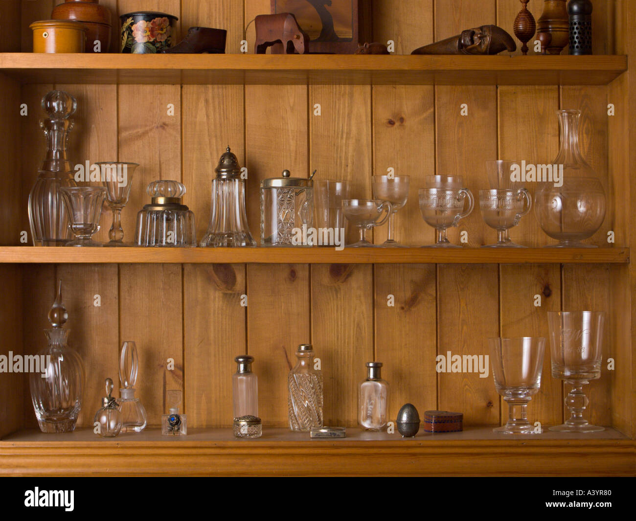 Antique glass on a wooden shelf Stock Photo