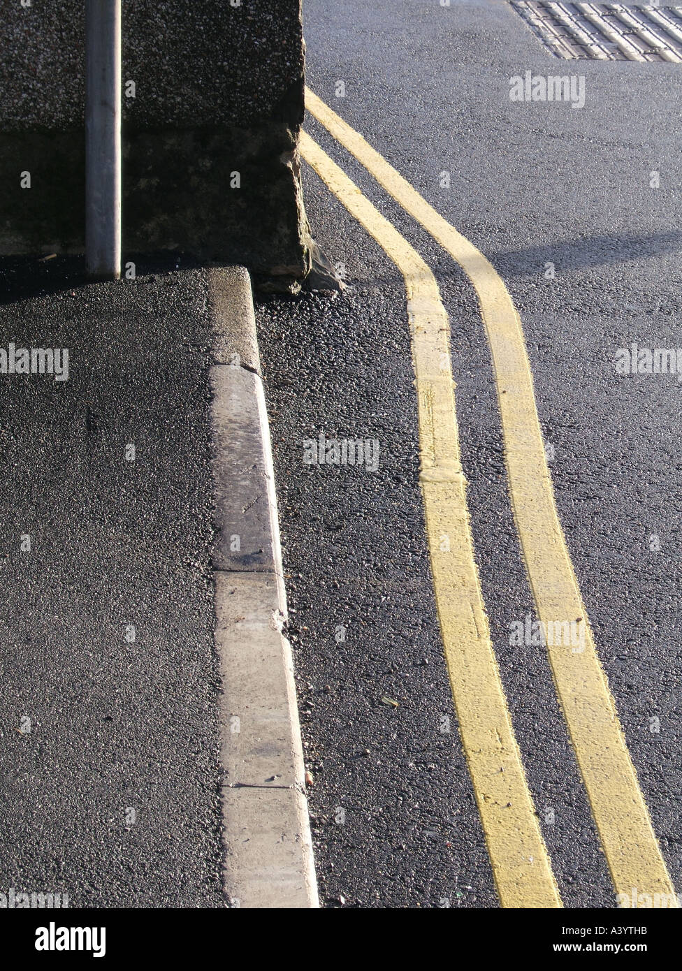 fresh paint double yellow lines on road Stock Photo Alamy