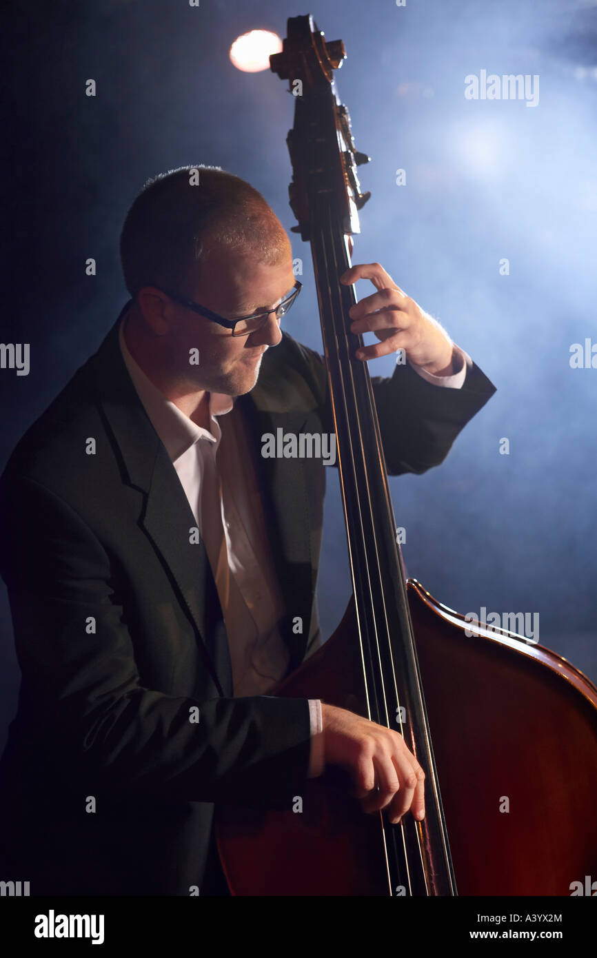 Double bass player on stage, portrait Stock Photo