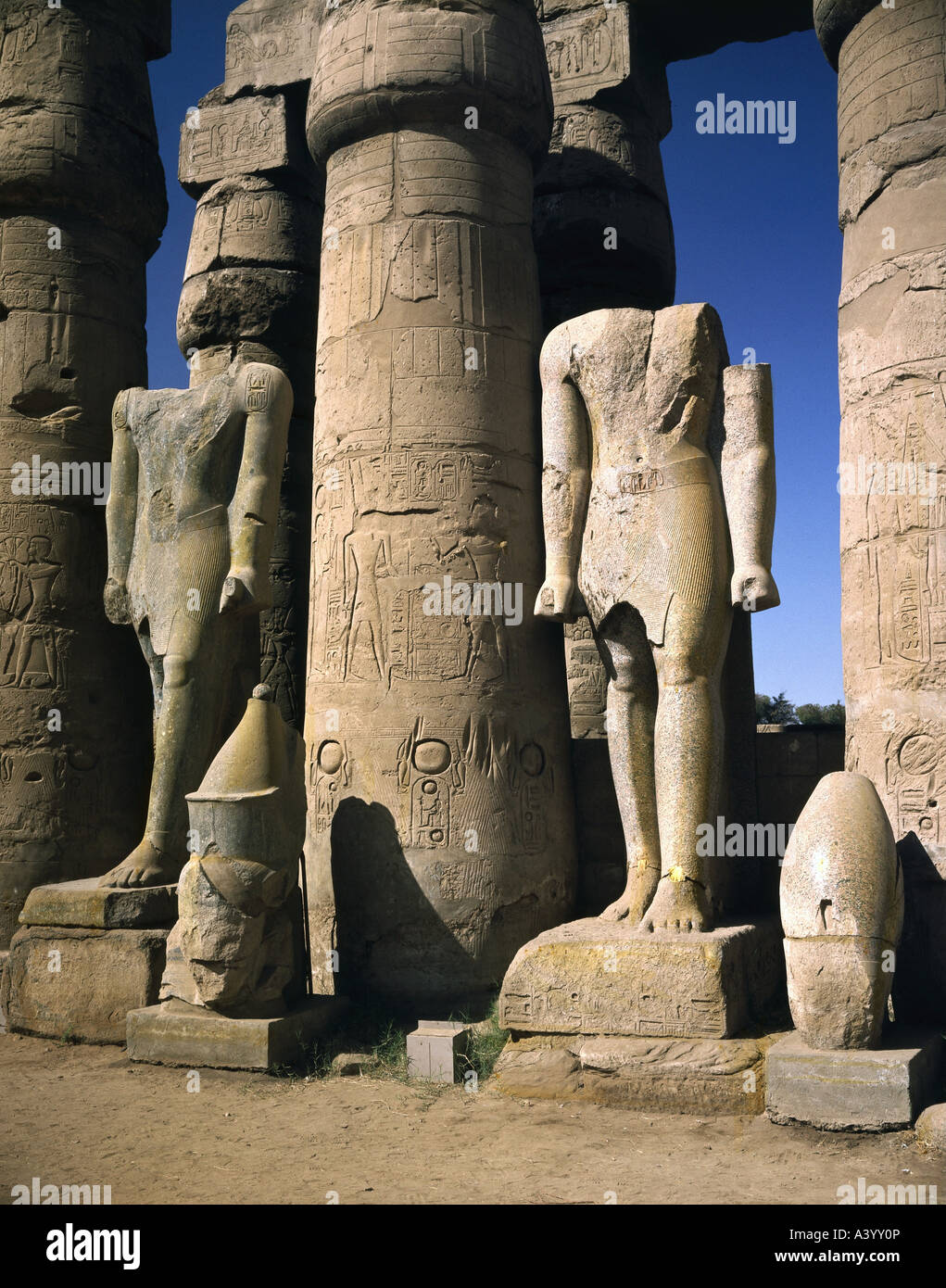 travel /geography, Egypt, Luxor, buildings, temple, Theban divine family Amun, Mut, Chons, exterior view, temple of Ramesses II, southern part, statues of pharaoh Amenhotep III, architect Amenhotep son of Hapu, 1402 - 1364 B.C., extensions under Ramesses II, 1303 - 1236 B.C., historic, historical, Africa, architecture, temples, ancient world, New Kingdom, 18th / 19th dynasty, 15th - 13th century B.C., column, columns, statue, sculpture, sculptures, ancient world, Stock Photo