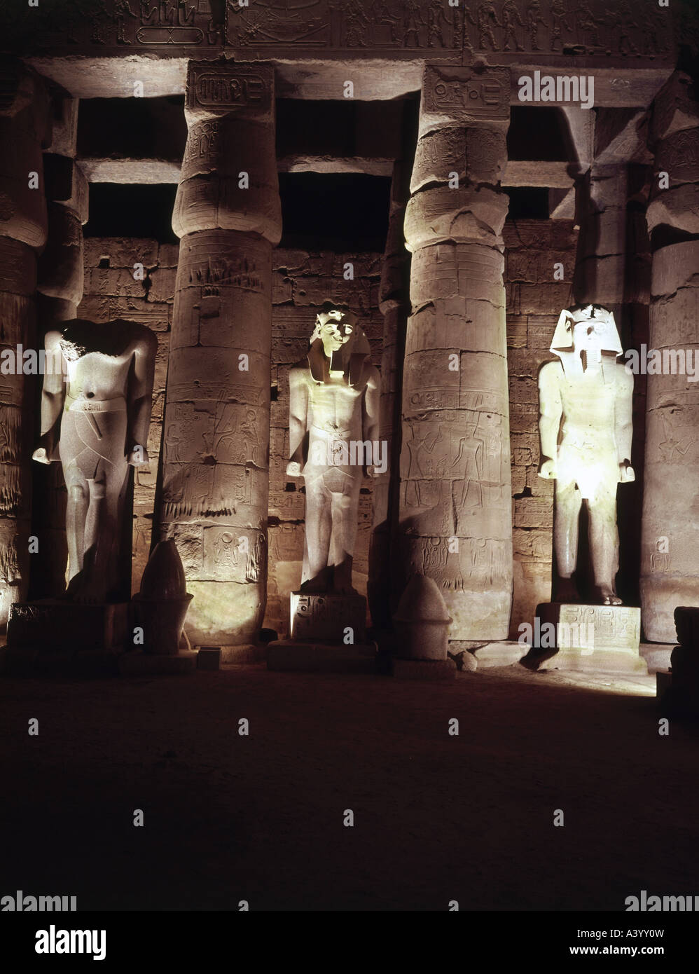 travel /geography, Egypt, Luxor, buildings, temple, Theban divine family Amun, Mut, Chons, exterior view, night, temple of Ramesses II, southern part, statues of pharaoh Amenhotep III, architect Amenhotep son of Hapu, 1402 - 1364 B.C., extensions under Ramesses II, 1303 - 1236 B.C., historic, historical, Africa, architecture, temples, ancient world, New Kingdom, 18th / 19th dynasty, 15th - 13th century B.C., column, columns, statue, sculpture, sculptures, ancient world, Stock Photo