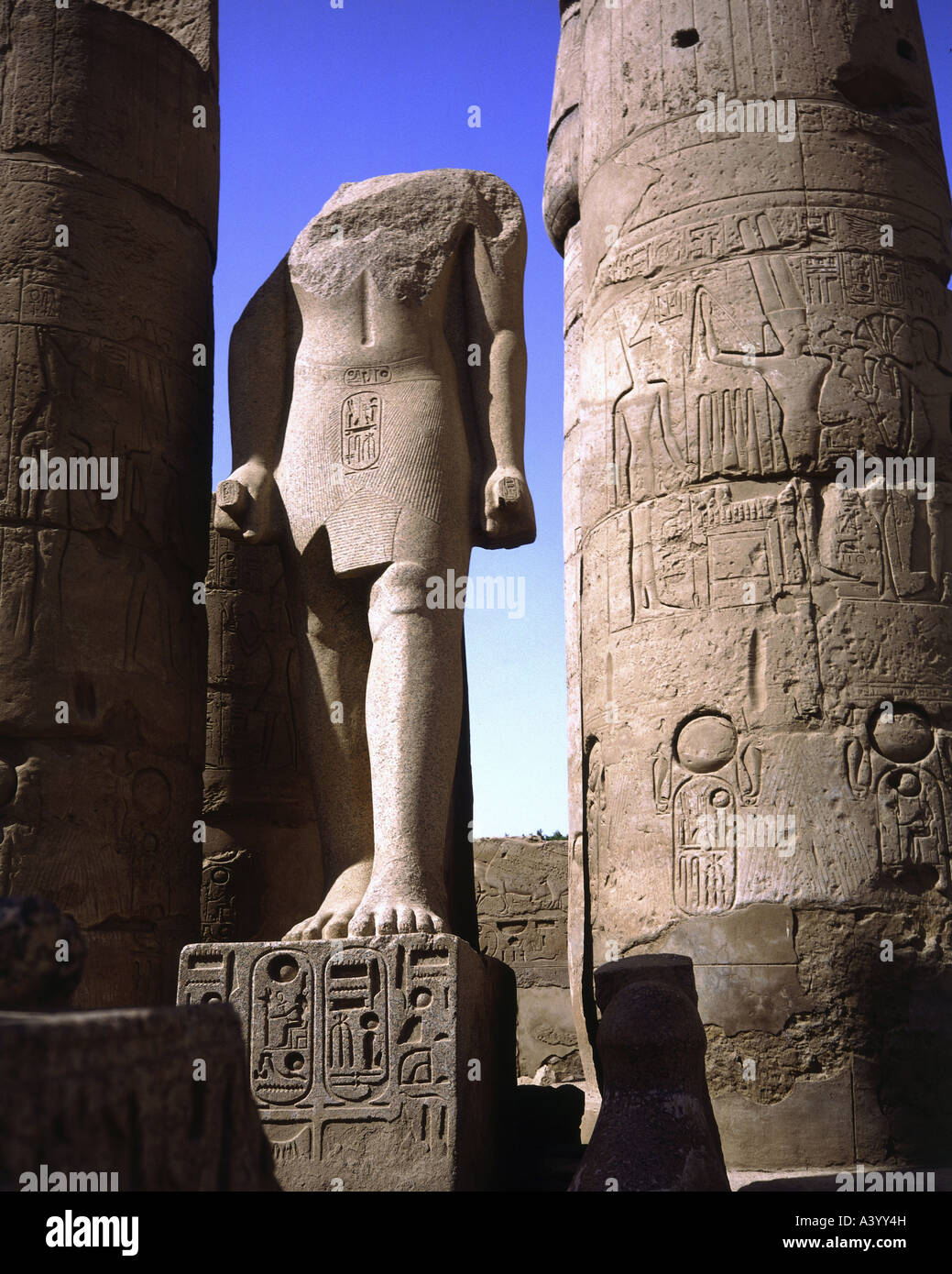 travel /geography, Egypt, Luxor, buildings, temple, Theban divine family Amun, Mut, Chons, exterior view, temple of Ramesses II, southern part, statue of pharaoh Amenhotep III, architect Amenhotep son of Hapu, 1402 - 1364 B.C., extensions under Ramesses II, 1303 - 1236 B.C., historic, historical, Africa, architecture, temples, ancient world, New Kingdom, 18th / 19th dynasty, 15th - 13th century B.C., column, columns, statues, sculpture, sculptures, ancient world, Stock Photo