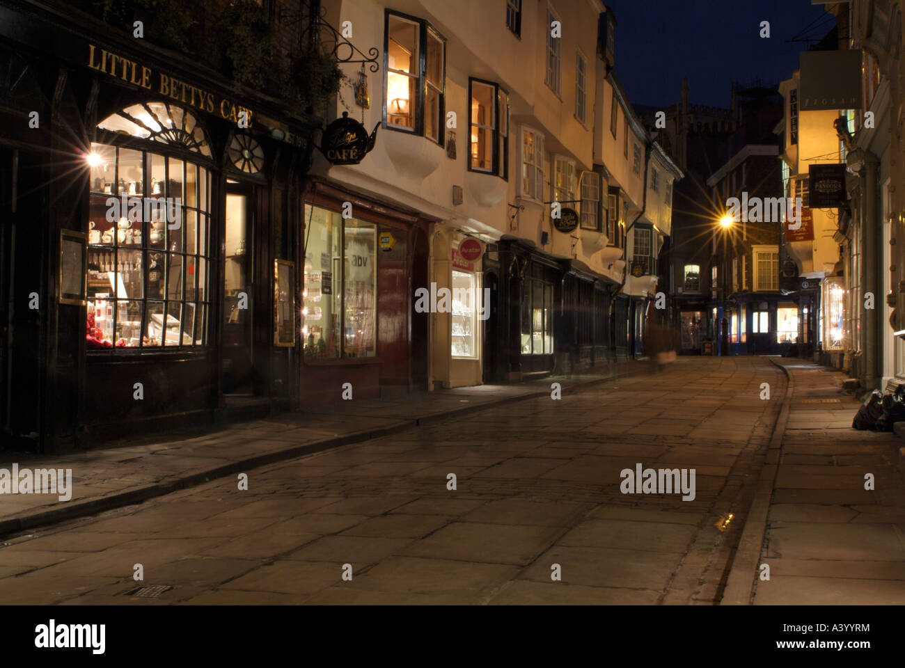 Looking north-east along the old paved street of Stonegate at night, York. Stock Photo