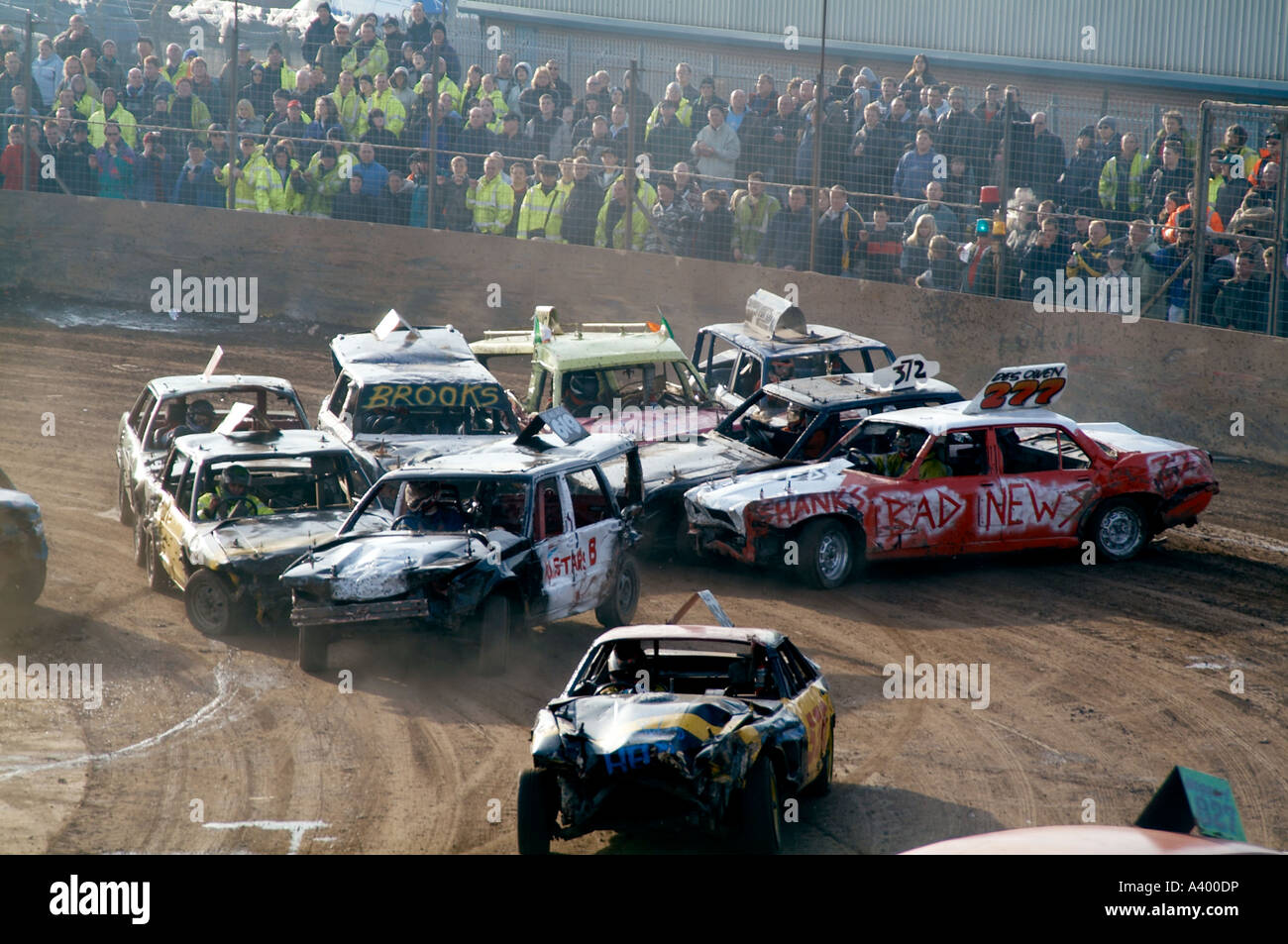 chaos at the start of a banger race at a stock car track Stock Photo