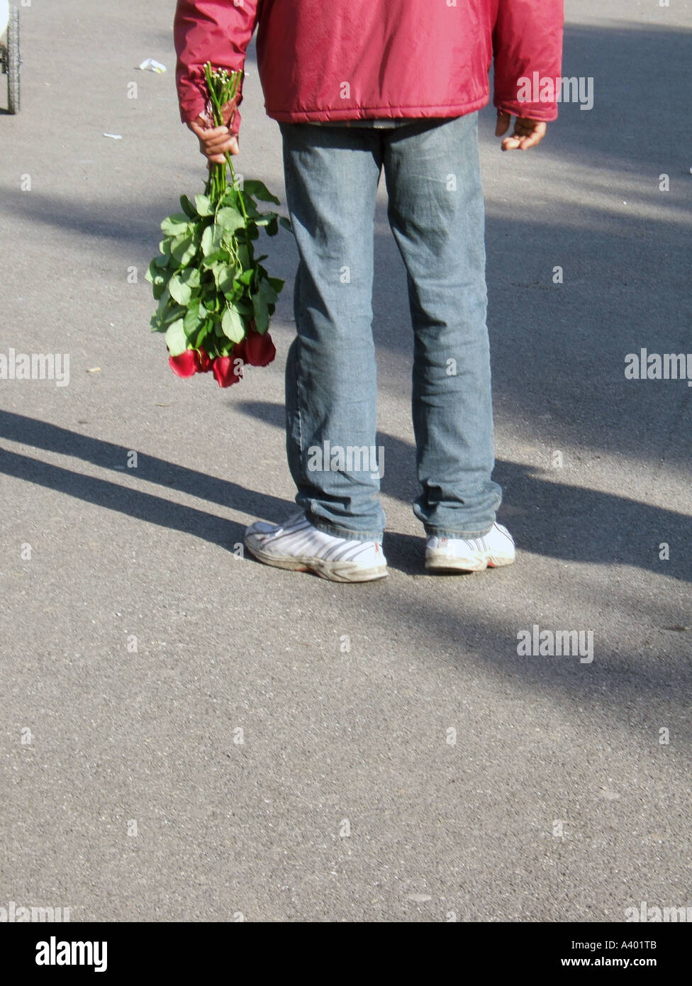 man holding bunch of red roses Stock Photo - Alamy