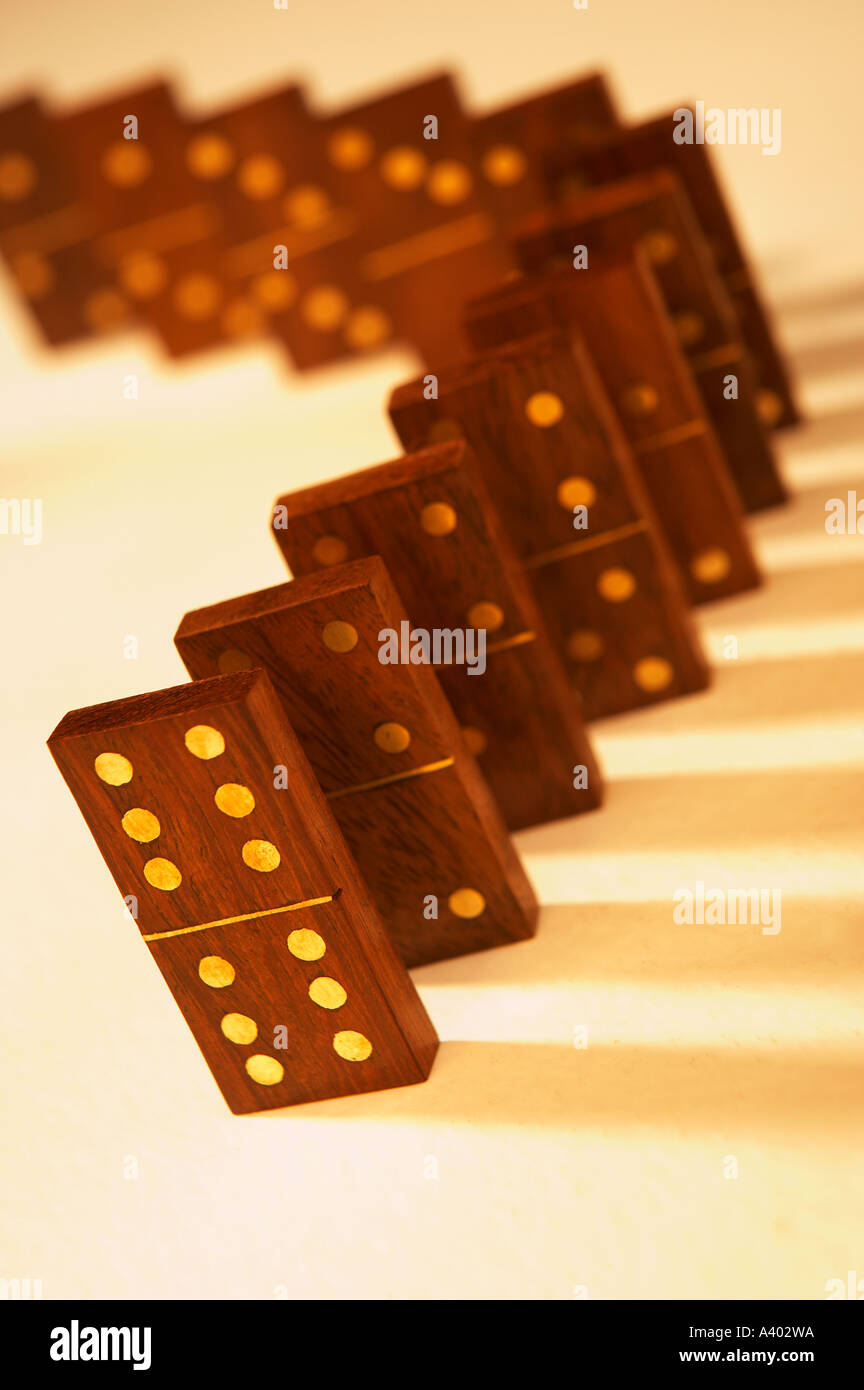 ROW OF SEVERAL ANTIQUE WOOD AND BRASS DOMINOES Stock Photo