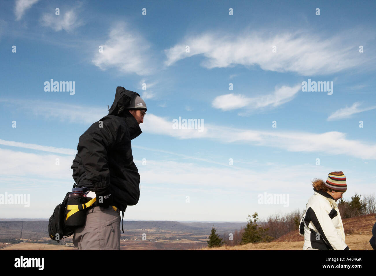 Two hikers on a mountain top Stock Photo