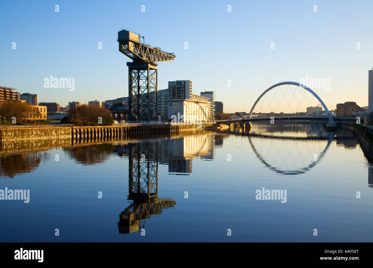 Early morning sunlight on River Clyde, Glasgow looking to new Arc Bridge, (squinty footbridge), Glasgow Scotland UK Stock Photo