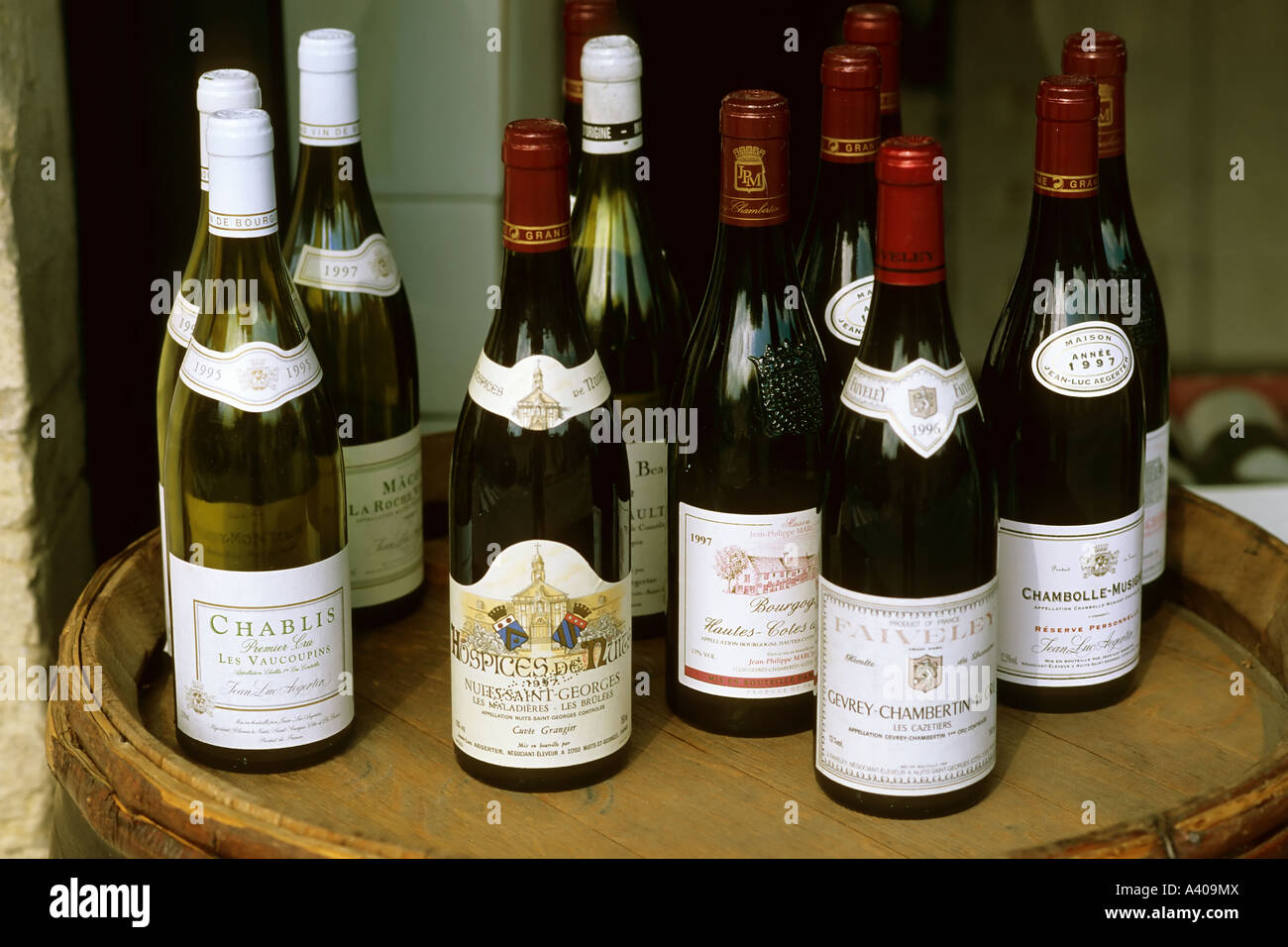 FRANCE BURGUNDY  NUITS-ST-GEORGES  SHOP DISPLAY WITH RED AND WHITE WINE BOTTLES Stock Photo