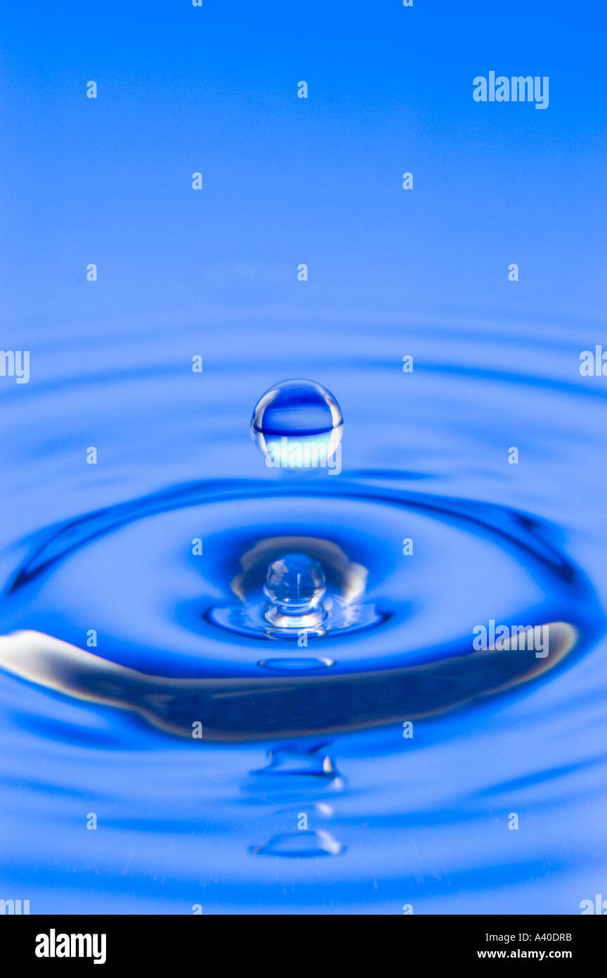 Single water drop into water Stock Photo Alamy
