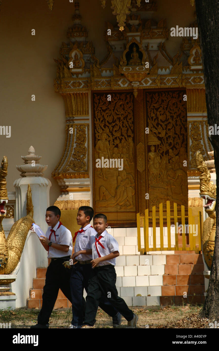 children in school uniform at the temple Wat That Foun Stock Photo