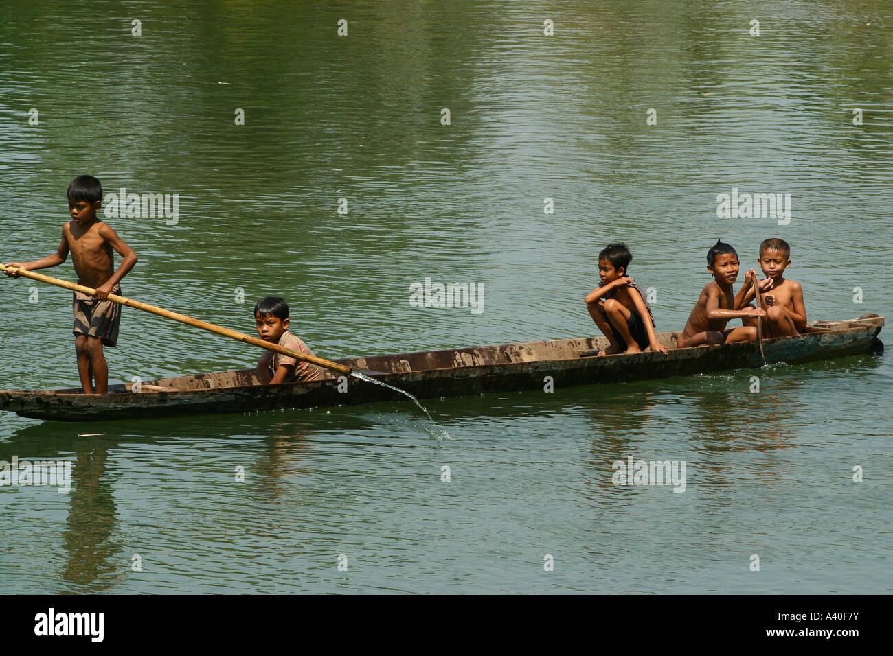children on a boat near Don Khon Stock Photo