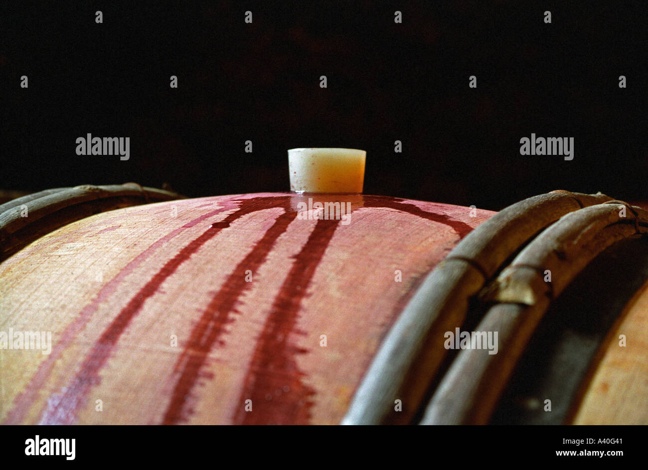 Red wine in an oak barrel at Lucien Muzard in Santenay, Bourgogne Stock Photo