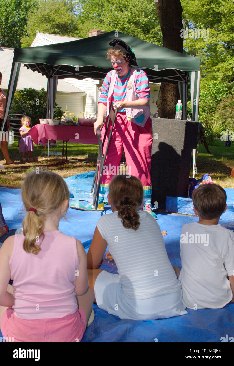 A Clown entertains children at a family picnic part of the USA lifestyle Stock Photo