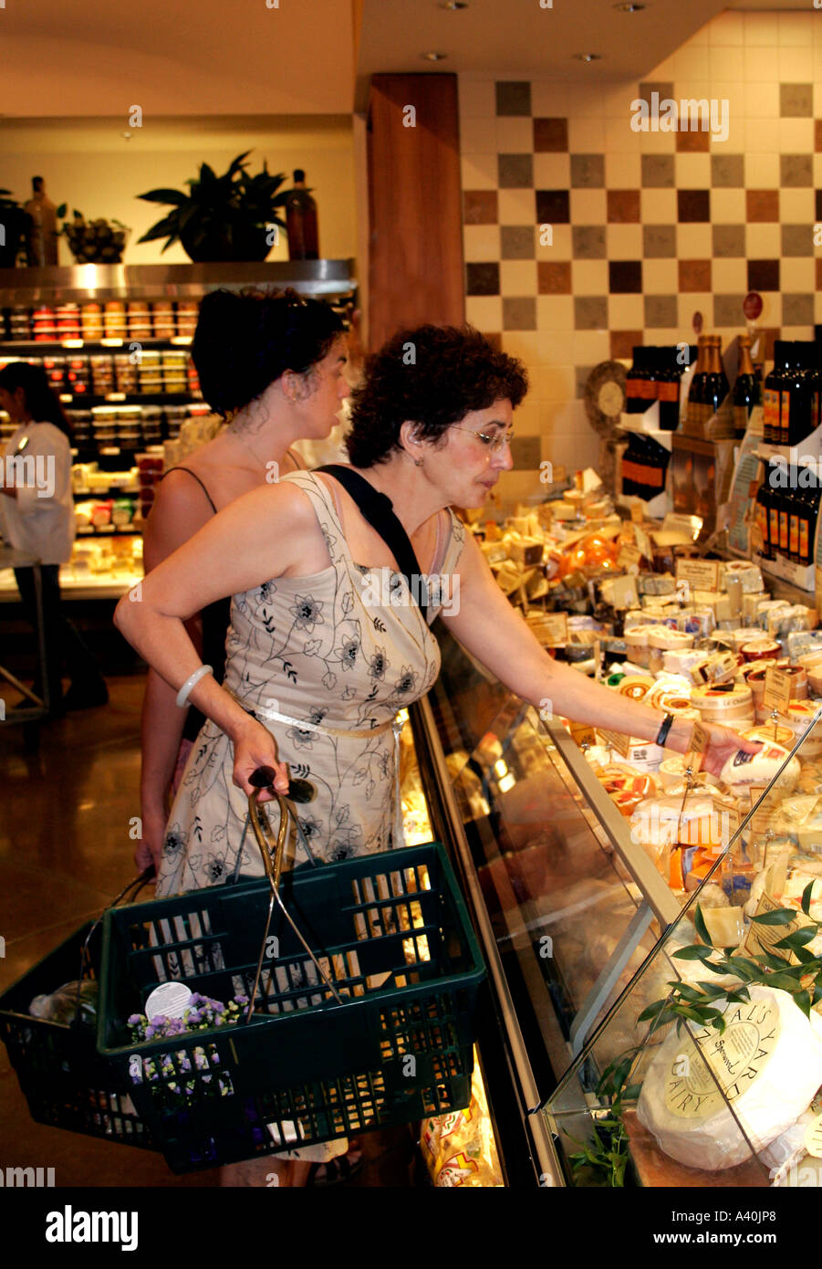 A Mother and Daughter shop in a food market Stock Photo