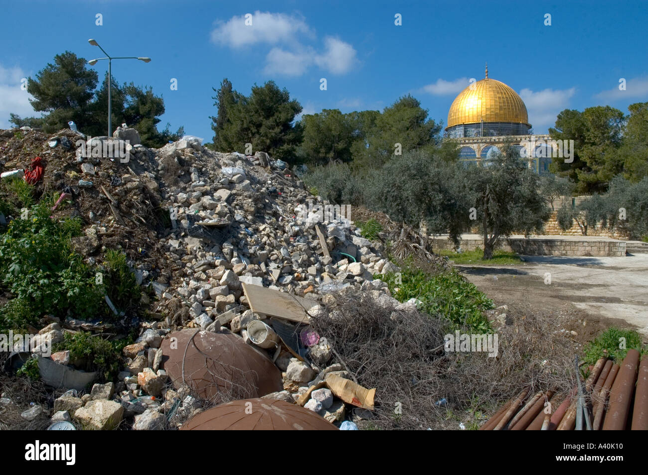 Israel Jerusalem Old City Esplanade of the mosques The Dome of the Rock piles of rubbles from controversial building sites with dome in bkgd Stock Photo