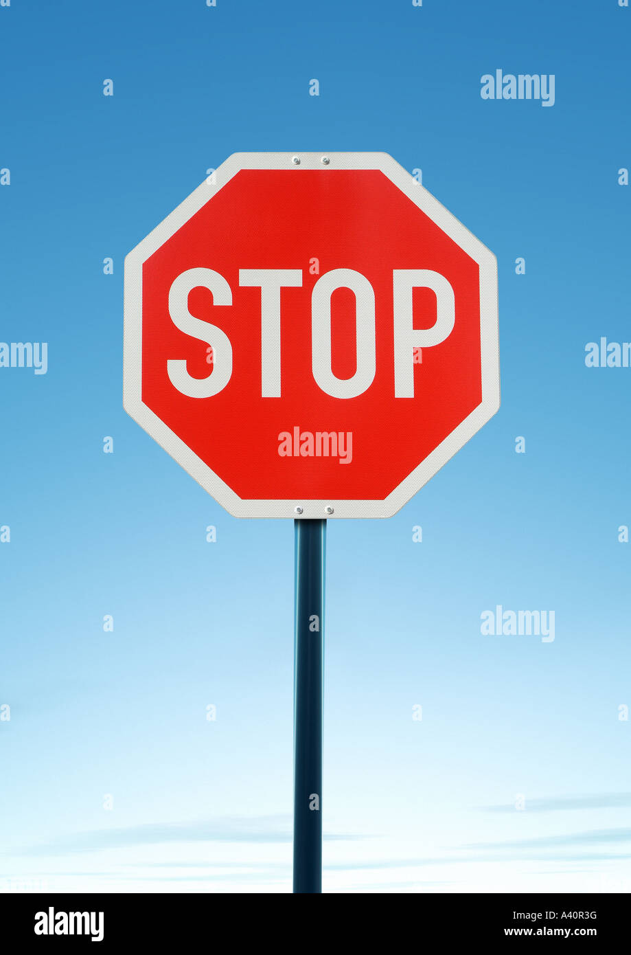 stop sign Stoppschild vor blauem Wolkenhimmel Stock Photo