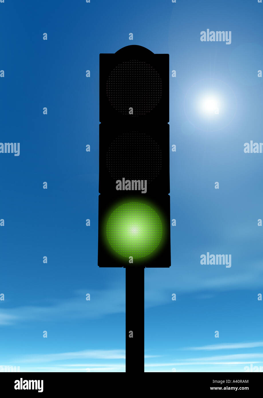green Traffic light device before blue sky Ampelanlage auf grün vor blauem Himmel Stock Photo