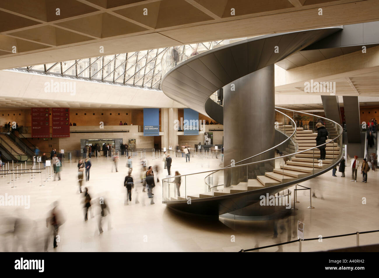 SPIRAL STAIRCASE INSIDE THE MAIN ENTRANCE OF THE LOUVRE MUSEUM, PARIS