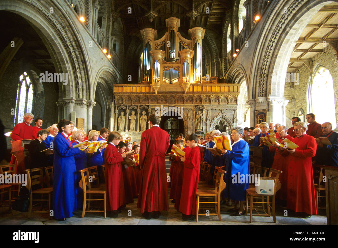 St Davids Cathedral choir with choirboys and choirgirls choristors Pembrokeshire Cymru Wales UK United Kingdom GB Great Britain Stock Photo