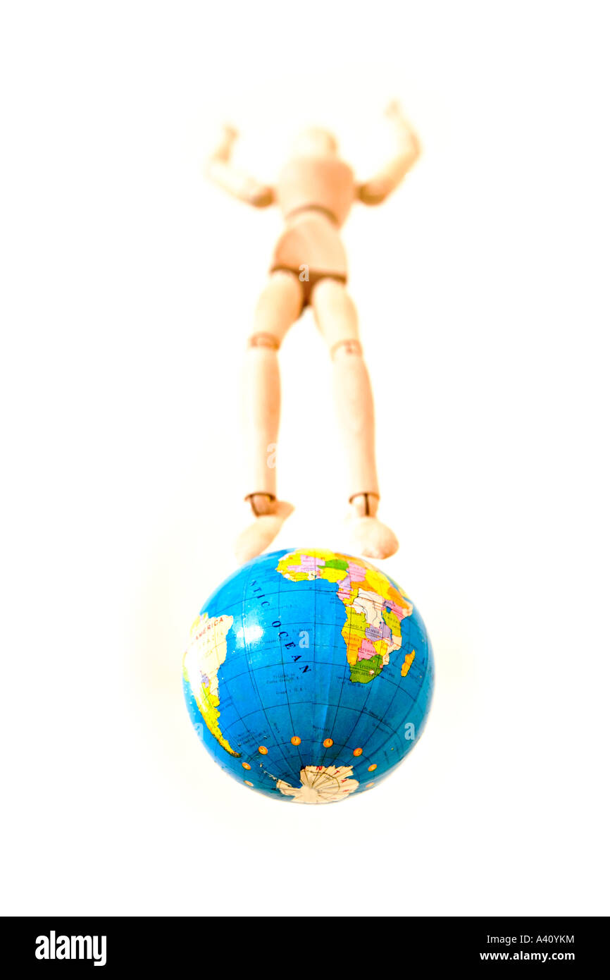 Mannequin standing on globe floating in mid air Stock Photo