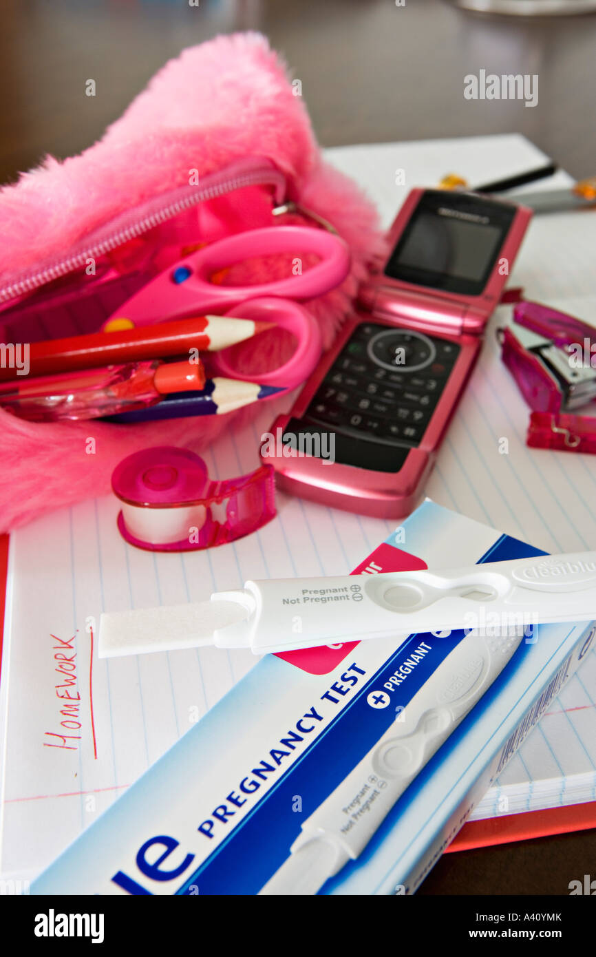 Pregnancy testing kit amongst contents of schoolgirl pencil case Stock Photo