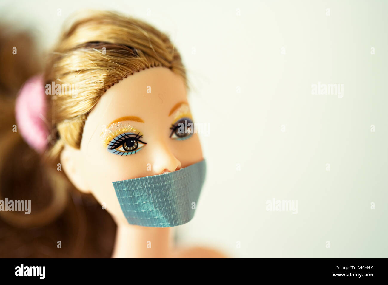 Barbie doll with Gaffa tape over mouth Stock Photo - Alamy
