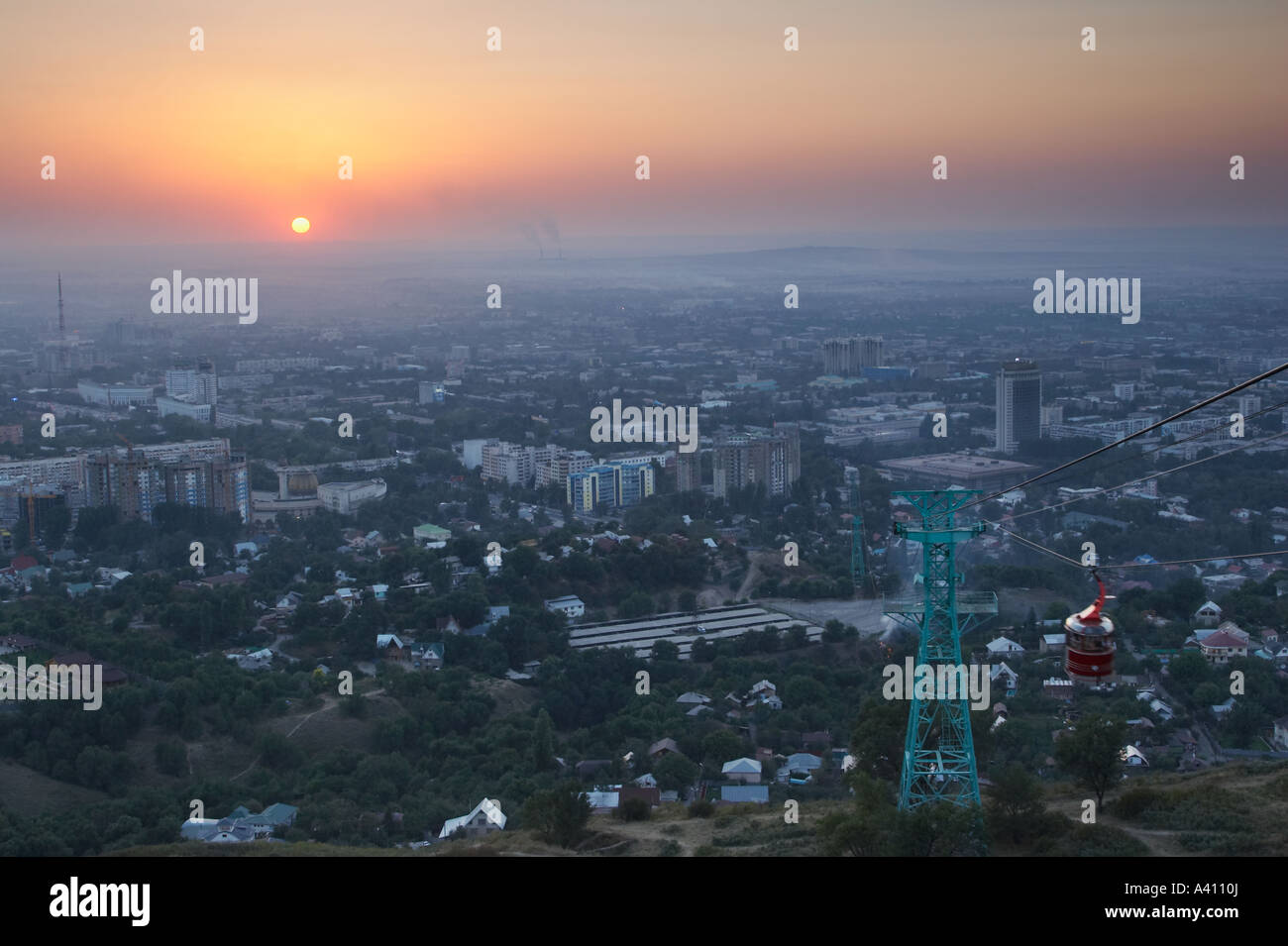 Sunset Over Almaty With Cable Car Stock Photo