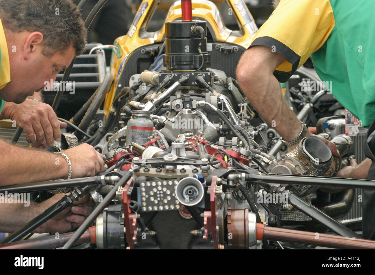 mechanics working on race car engine Stock Photo Alamy