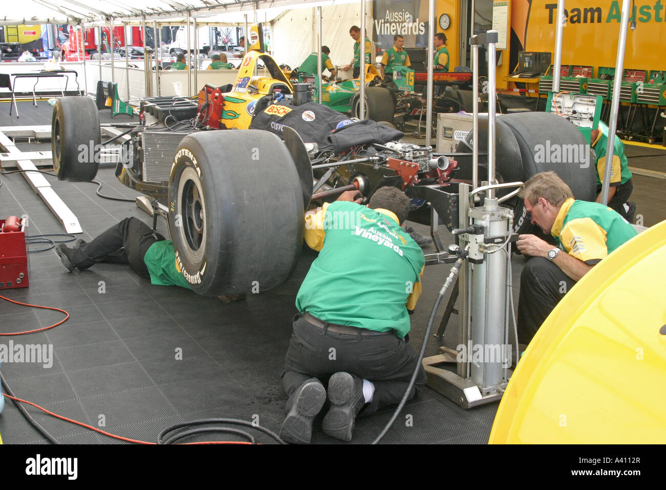 garage-racing-crew-mechanics-high-resolution-stock-photography-and