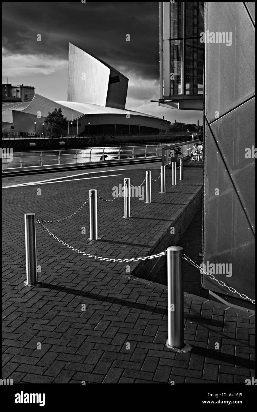 Dramatic light at Salford Quays Manchester Ship Canal and British War Museum North from the Lowry Theatre in Monochrome Stock Photo