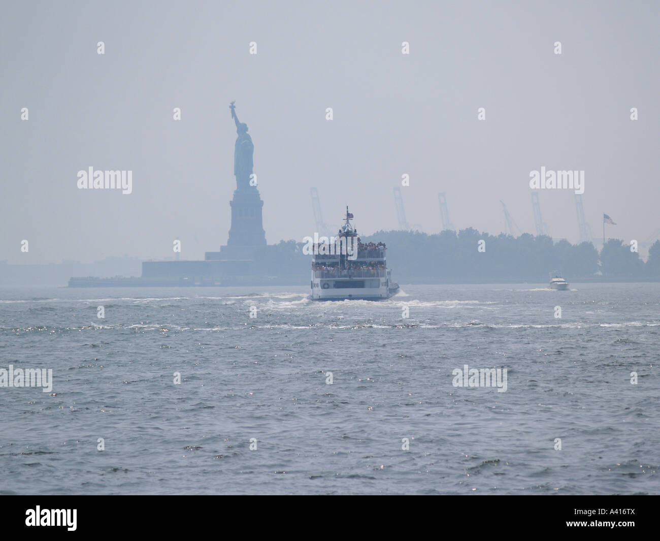 Ferry from Battery Park to the Statue of Liberty, Liberty Island, New York Harbour New York City USA Travel Stock Photo