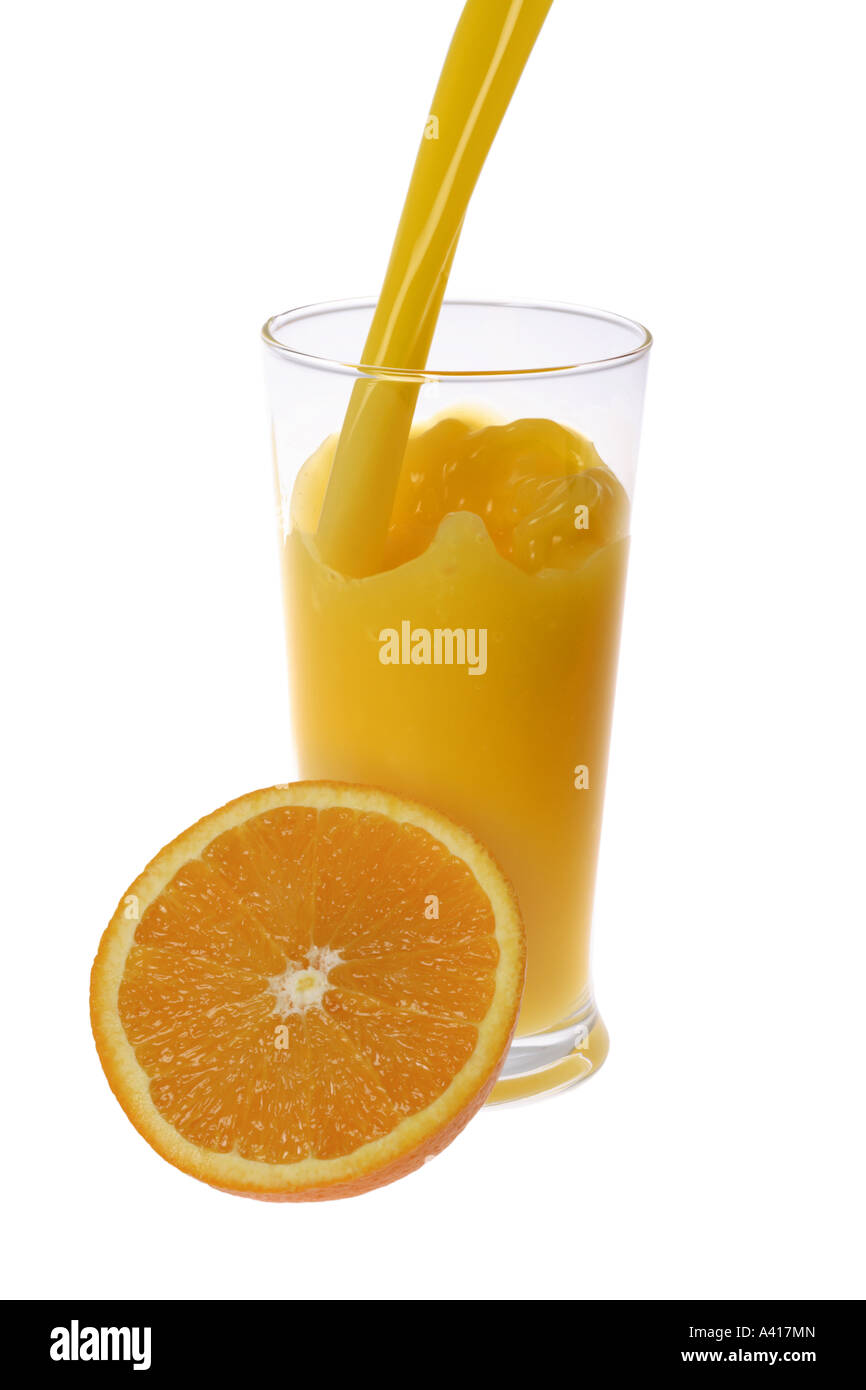 Pouring Glass of Orange Juice Stock Photo Alamy