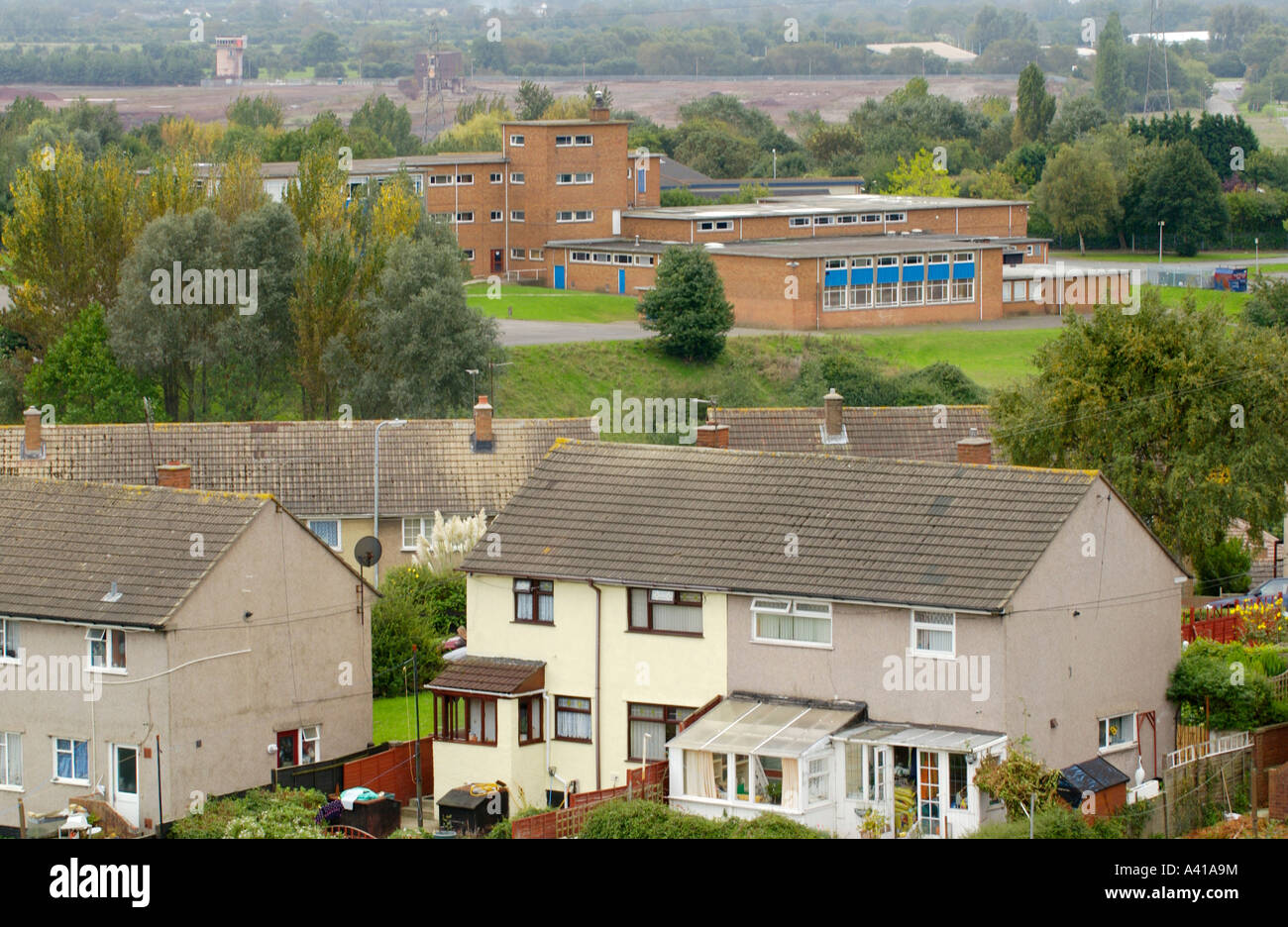 Hartridge High School viewed over Ringland housing estate to industrial area beyond Newport South Wales UK Stock Photo